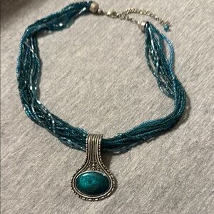 Elegant Teal Beaded Necklace with Silver Pendant